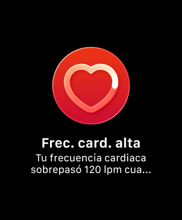Apple Watch Series 12, caja de aluminio, color oro claro, app ECG, instrucción en pantalla de mantener el dedo en la Digital Crown para iniciar la lectura de electrocardiograma, corazón rojo en el medio de la pantalla, correa loop deportiva, color borgoña