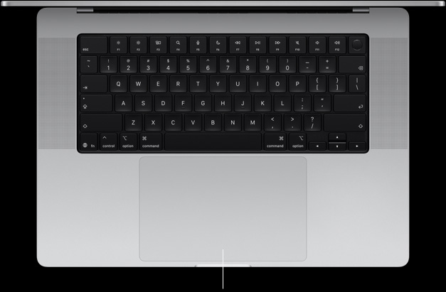 Vue en plongée du MacBook Pro 16 pouces ouvert, montrant le trackpad Force Touch au bas du clavier