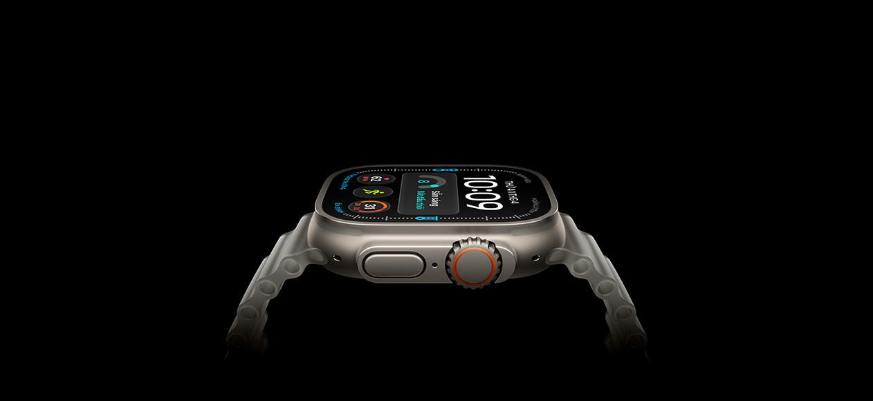 Apple Watch Ultra 4, titanium case, natural color, right exterior, Digital Crown, raised side button, digital watch face, translucent gray Ocean Band